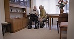 Old couple with album, memory and retirement together, life and relax with communication and pictures. Love, care and retired people in nursing home, memories and talking with elderly man and woman
