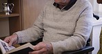 Reading, talking and senior man with woman in a house relaxing with communication and care. Old couple love, marriage and retirement with a old male and a book speaking about life together in a house