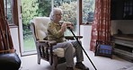 Alzheimer, retirement and senior woman in nursing home by window with memories, nostalgia and thoughtful. Mental health, depression and sad, lonely and elderly lady sitting on chair in living room