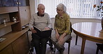 Relax, book and senior couple reading story together, bonding and enjoying quality time in house. Love, storytelling and elderly retired man and woman study or read novel, literature or books in home