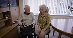 Photo album, relax and elderly couple in home reading together, bonding and enjoying quality time. Love, memory and senior retired man and woman talking about picture books for nostalgia or history