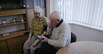 Health, blood pressure and disability with an old couple together in their retirement home for wellness. Medical, cardiovascular and cholesterol with a mature man and woman testing for hypertension