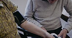 Health, blood pressure and retirement with a senior couple together in their home for a wellness checkup. Medical, cardiovascular and cholesterol with a mature man and woman testing for hypertension