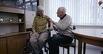 Health, blood pressure and disability with an old couple together in their retirement home for wellness. Medical, cardiovascular and cholesterol with a mature man and woman testing for hypertension