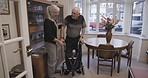 Walker, old woman help senior man and physiotherapy for recovery, healthcare and disability in nursing home. Love, male elderly citizen and mature female assist husband, living room and retirement