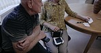 Love, old couple and planning in living room, budget and choices with paper, invest and pension fund. Mature man, senior citizen and elderly woman with schedule, conversation and check payments