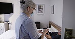 Covid, coffee and assisted living with a senior man and nurse in the bedroom of a retirement home. Healthcare, medical and tea with a mature male patient and female medicine professional in a house