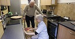 Kitchen, home and senior couple doing laundry together for home chores or spring cleaning. Housework, hygiene and elderly woman washing clothes while talking to husband in retirement at their house.