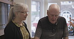Senior man, caregiver and helping to walk in nursing home, rehabilitation center or recovery. Happy elderly nurse, therapist or counselor looking after old male in healthcare support for walking