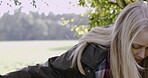 Woman, travel and jumping fence in nature for adventure, trip or exploring the countryside. Female tourist, explorer or traveler walking in forest through obstacle for holiday weekend or exploration
