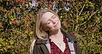 Woman, travel and smile in relax for nature, fresh air or sunshine getting vitamin D by countryside. Happy female traveler smiling in joyful happiness for calm, freedom or natural environment