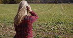 Spring, nature and peace with woman in field for relax, sunshine and breathing fresh air. Environment, growth and summer with girl enjoying countryside park for sunset, freedom and happiness