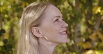 Nature, freedom and face of woman with smile enjoying calm, relax and quality time in countryside. Trees, motivation and girl with happy mindset, peace and wellness on journey, adventure and holiday