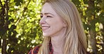 Nature, trees and face of woman with smile enjoying freedom, fresh air and quality time outdoors. Wellness, motivation and girl with happy mindset, peace and calm on journey, adventure and holiday