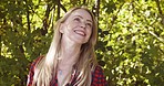 Peace, nature and health with woman in countryside park for freedom, relax and summer break. Garden, environment and happy with girl enjoying outdoors for carefree, smile and breathing fresh air
