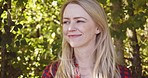 Wellness, nature and face of woman with smile enjoying freedom, fresh air and quality time outdoors. Forest, motivation and girl with happy mindset, peace and calm on journey, adventure and holiday
