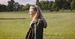 Park, travel and a happy woman walking in field for sightseeing, relax and solo trip on nature background. Smile, peaceful and young female enjoy calm, quiet and satisfied walk in a forest in Mexico 