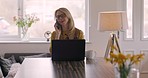 Laptop, typing and woman on a phone call in her dining room working on a corporate project. Work from home, technology and mature female employee on a mobile conversation on cellphone in her house.
