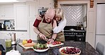 Love, happiness and old couple in kitchen cooking lunch, healthy food and vegetable diet in retirement. Happy woman, senior man in apron and conversation with meal prep, marriage bonding in apartment