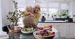 Love, hug and old couple in kitchen with salad for lunch, healthy food and vegetable diet in retirement. Happy woman, senior man in apron and conversation, meal prep and marriage bonding in apartment