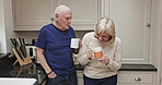 Coffee, laughing and a senior couple in the kitchen of a retirement home, chatting or bonding together. Love, drink or beverage with a mature man and woman having fun while talking in a house