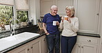 Coffee, morning and a senior couple in the kitchen of a retirement home, chatting or bonding together. Love, drink or beverage with a mature man and woman enjoying caffeine while talking in a house