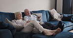 Smile, tv and senior couple watch news, movies and cable show of media broadcast on living room sofa. Happy man, woman and old people relax with television remote, subscription and streaming program