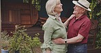 Happy, dance and senior couple in backyard for bonding, quality time and having fun together. Retirement, marriage and in love elderly man and woman in garden dancing, laughing and singing at home