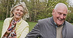 Health, senior couple and walking for exercise, fitness and wellness being healthy together in nature. Retirement, man and woman enjoy workout in a park or garden