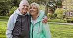 Happy senior couple outdoor and in love, spending quality time together in nature. Retirement and man and woman enjoy a relax day in a park or garden