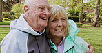 Happy senior couple outdoor and in love, spending quality time together in nature. Retirement and man and woman enjoy a relax day in a park or garden