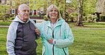 Happy senior couple outdoor and in love, spending quality time together in nature. Retirement and man and woman enjoy a relax day in a park or garden
