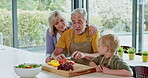 Cooking, grandparents and child with breakfast food in the kitchen of a house. Elderly man and woman preparing a healthy meal with their grandson at home