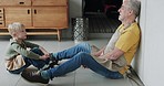 Old man and grandson bonding together in the kitchen with conversation and support at home. Love, relationship and senior grandfather relax with discussion and family advice