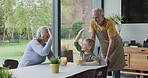 Grandparents, high five and grandson talking with orange juice together in the kitchen with support at home. Love, support and motivation with discussion and family advice
