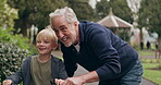 Grandfather teaching young boy to ride bicycle in garden, park and outdoor. Senior man helping happy kid with cycling on bike for fun, support and skill in nature