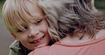Young boy hugging grandmother in park, garden and outdoor for love, care and support. Face of happy kid, senior woman and embrace with smile together