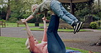 Grandmother lifting young boy with legs at park for flying, fun and bonding together. Happy senior woman, grandchild and playing airplane game outdoor