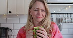 Mature woman, drinking coffee and thinking in a kitchen while happy with a smile and memory. Face of a female model person with a tea cup at home for me time, relax and morning routine or peace