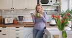 Coffee, phone and relax with woman in kitchen streaming for social media, communication and morning. Happy, wake up and online with person drinking tea at home for networking, contact and website