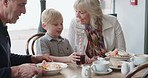 Food, grandparents and kid with service in restaurant together, happy and excited eating at table. Grandmother, grandfather and child in cafe, waiter at lunch and spending quality time with family.