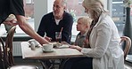 Food, grandparents and child bonding in restaurant together, happy and excited eating at table. Grandmother, grandfather and kid in cafe, waiter service at lunch and spending quality time with family
