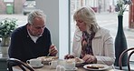 Breakfast, cafe and senior couple eating together for bonding, quality time and conversation. Restaurant, marriage and mature man and woman with food to relax, chat and morning date in coffee shop