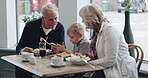 Restaurant, breakfast with grandparents and a boy using his phone in the morning while eating food. Family, grandmother and grandfather with their child grandson in a cafe together for bonding
