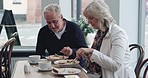 Breakfast, food and senior couple eating together for bonding, quality time and conversation. Restaurant, marriage and mature man and woman in cafe to relax, chat and morning date in coffee shop