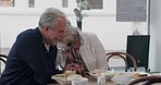 Lunch, cafe and happy senior couple eating together for bonding, quality time and conversation. Restaurant, marriage and mature man and woman laughing with food to relax, chat and date in coffee shop