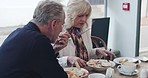 Breakfast, food and senior couple talking in cafe for bonding, quality time and conversation. Restaurant, marriage and mature man and woman eating and relax, chat and talking on date in coffee shop
