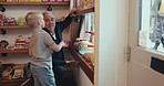 Family, grandpa and boy grandchild in a candy shop together for retail or commercial shopping as customers. Children, bonding and a senior grandparent shopping for sweets with his cute kid grandson