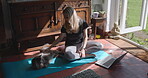 Meditation, home and woman brushing cat or pet to relax after exercise, workout and meditation for wellness. Yoga, health and female person touch animal or kitty as love after online fitness training