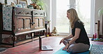 Yoga, laptop and peace with woman in living room for online class, social media and learning. Workout, meditation and fitness with person and video call at home for balance, spiritual and mindfulness